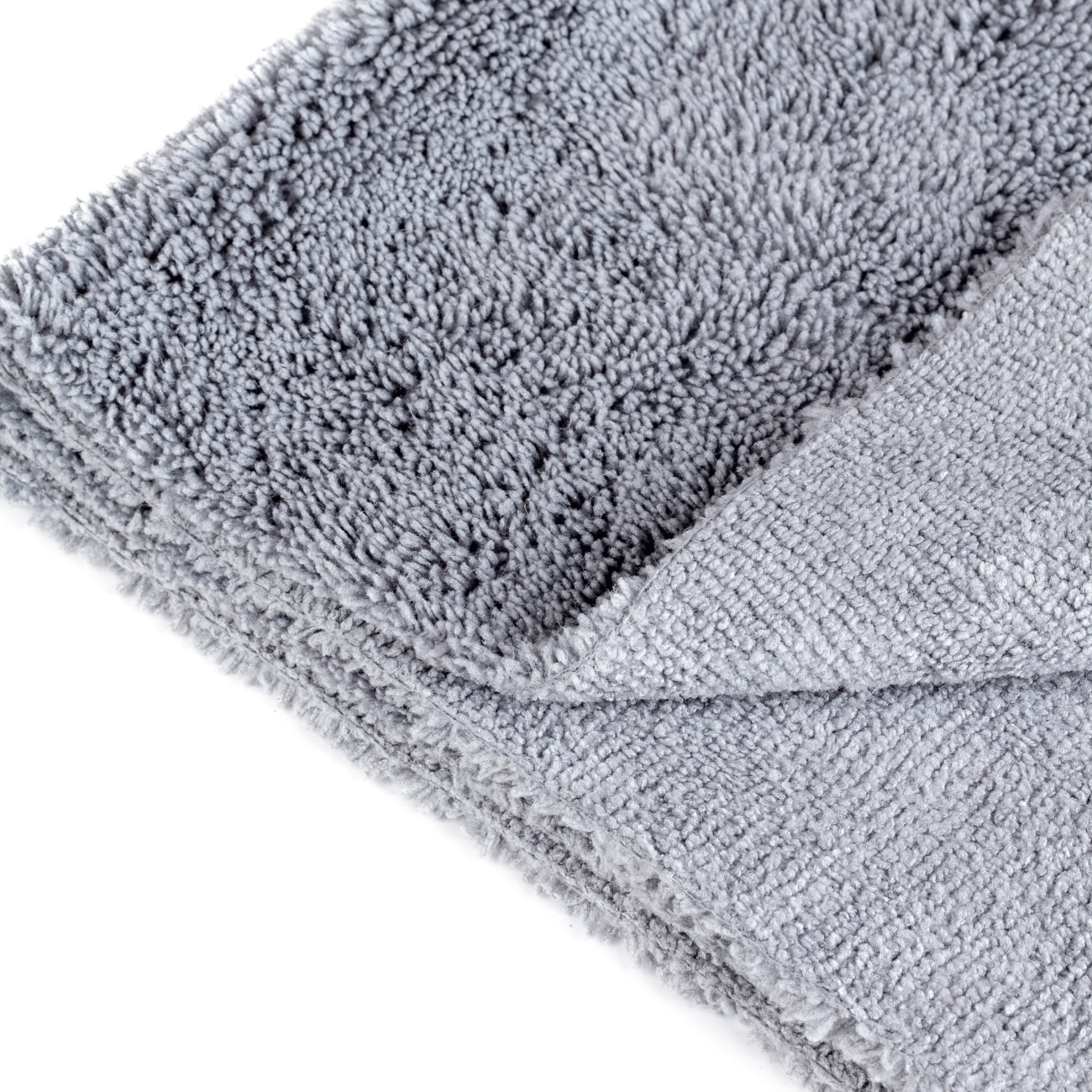 Een close-up van een gevouwen RUSH Allround Interieurdoek toont het zachte, gestructureerde oppervlak en de netjes afgewerkte randen.