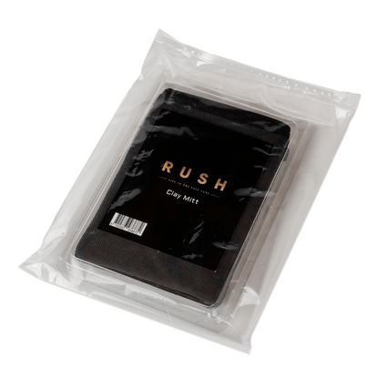 A black Clay Mitt for cars, packaged in a clear, resealable bag with gold and white label text and a visible barcode—ideal for lak reinigen.