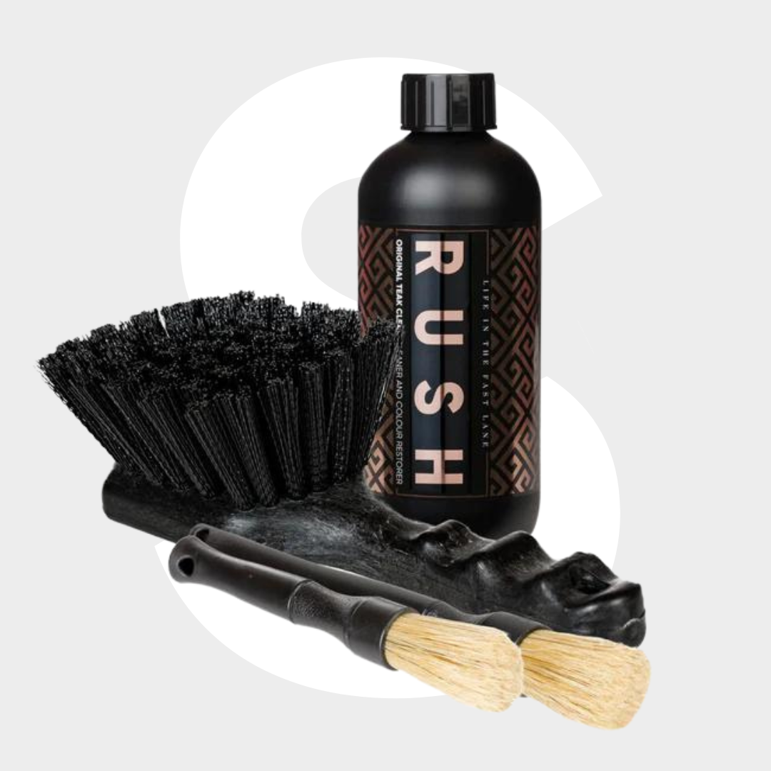The Original Teak Package features a black RUSH bottle, a black cleaning brush, two small wooden-handled bristle brushes, and a textured black tray—ideal for teak reinigen or applying teak reiniger—on a light gray background.