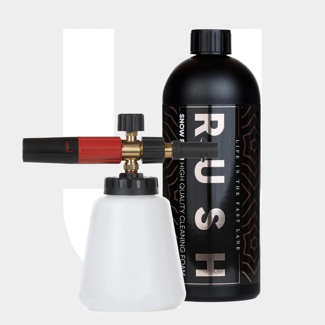 The Foam Cannon Package features a black RUSH bottle and a white sprayer with a black and red nozzle, both perfect for auto pre-wash and premium car cleaning. Set against a light gray background with a subtle white design.