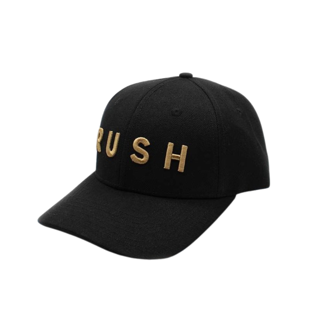 The RUSH Baseball Cap is a stylish, adjustable black cap featuring "RUSH" in bold gold lettering on the front, perfect for those living life in the fast lane. Displayed against a plain white background.